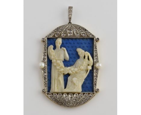 An Art Deco pendant depicting two Egyptian figures on a guilloche enamel ground, in platinum setting with rose cut diamonds, 