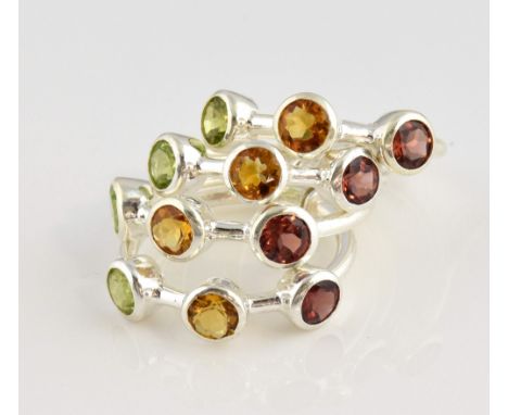 Multi band stacking ring, round cut peridot, citrine and garnets, mounted in white metal stamped silver, ring size R.     Gro