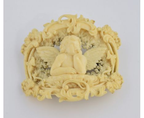 19th C Dieppe ivory brooch, central Cherub in a border of foliage and grape vines, measuring approximately 5.5 x 4.8 cm, with