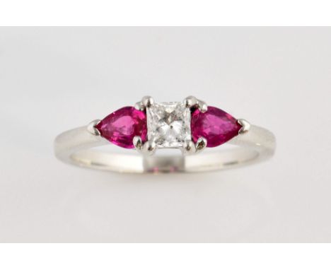 Ruby and diamond three stone ring, central princess cut diamond, estimated diamond weight 0.38 carat, set in between two pear