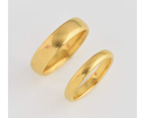 Two gold wedding bands, 5mm court wedding band, hallmarked London 1917, size N and 3mm court ring, size K, both  22 ct.     G