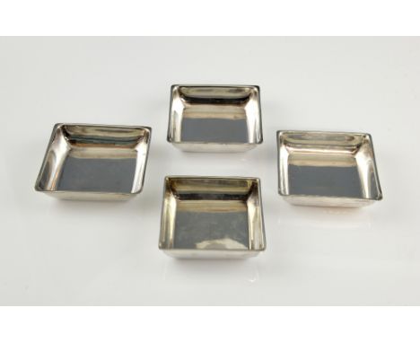 George V set of four silver graduated pin dishes, each square with slight everted rim, by Hukin & Heath, Birmingham 1929, the