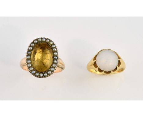 Edwardian opal ring set in 18 ct gold, ring size K and a citrine and pearl set ring rose coloured metal testing as 9 ct, size