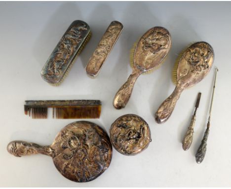 Chinese silver backed dressing table set, comprising hand mirror, four brushes, pot and cover, button hook, nail file and com