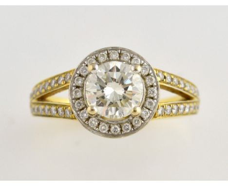 Diamond halo ring, central round brilliant cut diamond, estimated diamond weight 1.12 carats, estimated colour I/J and clarit