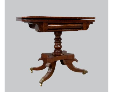 Regency mahogany card table, on turned central column, quatrefoil supports, brass feet and castors, 73xm x 92cm .    