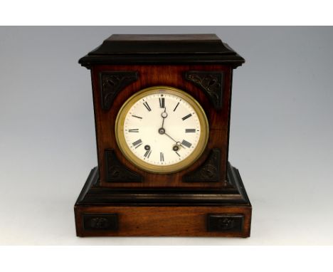 Walnut case mantle clock, the eight day movement striking on a gong, 31cm height..    