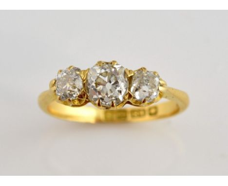 Edwardian diamond ring, set with three old cut diamond, estimated total weight 1.15 carats, estimated colour H/I and clarity 