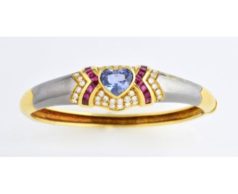 Sapphire, ruby and diamond bangle, set with a heart shaped blue sapphire to the centre weighing approximately 4.00 carats wit