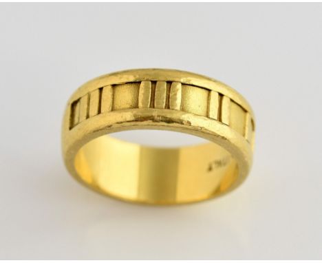 Tiffany & Co Atlas ring, with a channel of Roman numerals,, inside of band inscribed Tiffany & Co 1995, stamped 18 ct Italy, 