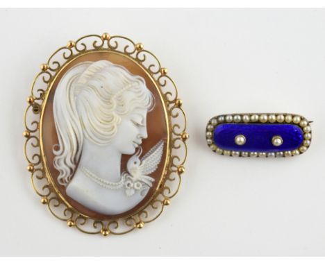 Two brooches, blue enamel and pearl mourning brooch, engraved on the reverse, with pin and catch fitting, measuring approxima