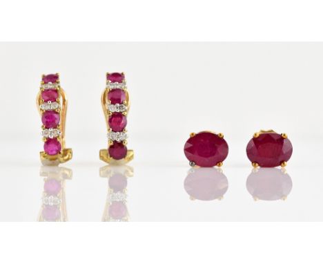 Two pairs of earrings, ruby and diamond set in half hoop with round cut rubies and round brilliant cut diamonds, with post an