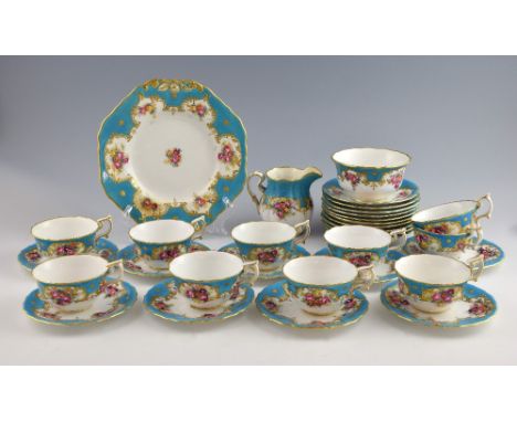 A Copeland Spode tea service to include cream jug, and sugar bowl in white and blue decorated with flowers and highlighted in