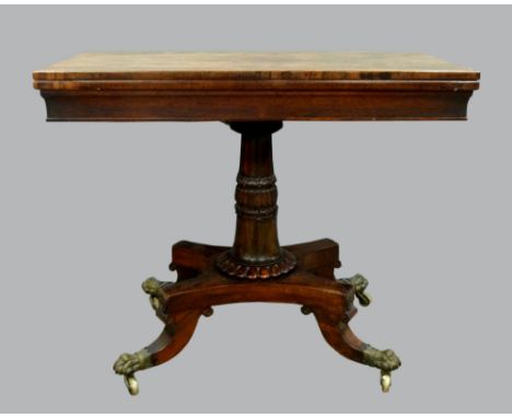 Regency rosewood folding card table with green baize lining on turned column and platform base, four legs with brass paw term