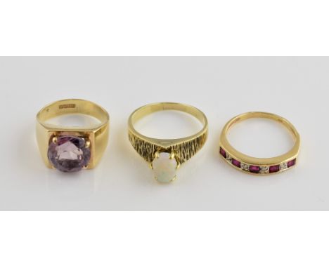 Three gem set rings,1970's amethyst ring, hallmarked Birmingham 1972, size H half, a vintage ring set with oval cabochon cut 