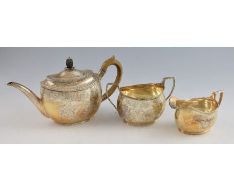 Victorian silver three piece matched tea service, comprising teapot, cream jug and sugar bowl, with bright cut decoration, te