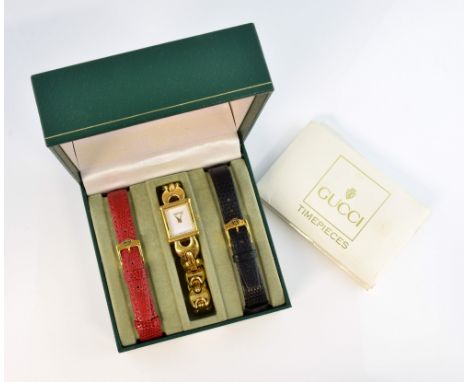 A ladies Gucci gold plated quartz bracelet watch, the plain white dial, rectangular case numbered 1800L, fitted to a gold pla