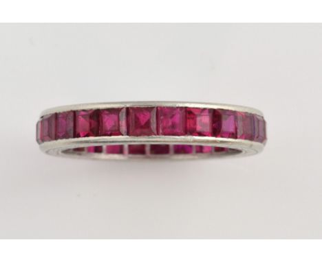 1930's full eternity ring, set with square cut synthetic ruby, estimated total weight 3.00 carats, mounted in white metal tes