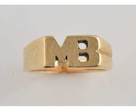 Gold ring, cut out initials MB, with textured band, in yellow metal stamped 14 ct, ring size K.     Gross weight 5.1 gramsTex