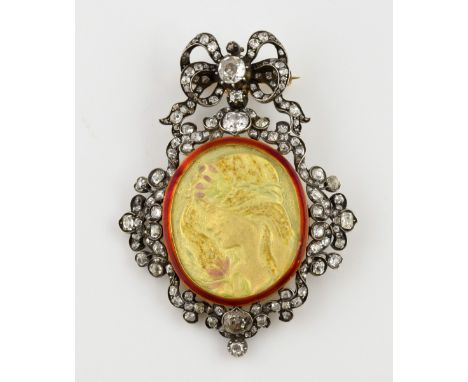 Diamond set pendant brooch, with old cut diamonds set in white metal, testing as silver and 18 ct, and red enamel frame with 