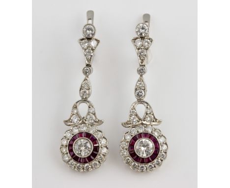 Pair of Art Deco style diamond and ruby set drop earrings, with central diamonds each estimated at 0.33 carat in milgrain set