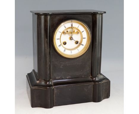 19th century black slate mantle clock the two train movement striking on a bell, 28cm high.    