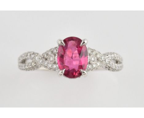 Ruby and diamond ring, with oval ruby of 1.35 carats, set in a diamond encrusted platinum mount, in 18 ct white gold,  ring s