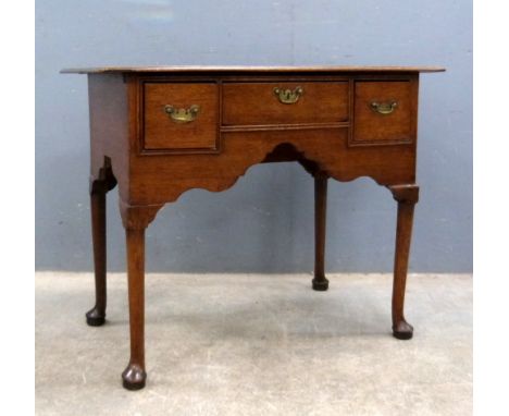 19th century oak low boy with three drawers, 70cm x 89cm .    Plank top with gap, damage to front corners of top, feet with r