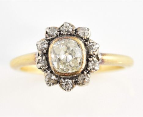 Edwardian diamond set ring with central  old cut stone of 0.45 carat in rub- over setting within a band of small diamonds, st