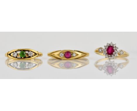 Three gem set rings, ruby and diamond three stone ring, size V, with diamond and green paste stone ring, size M, both mounted