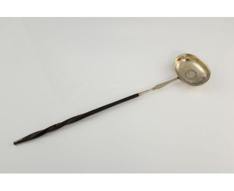 Georgian silver coin set punch ladle with baleen handle, the bowl set with a 1725 Shilling, apparently unmarked, 40 cm long. 