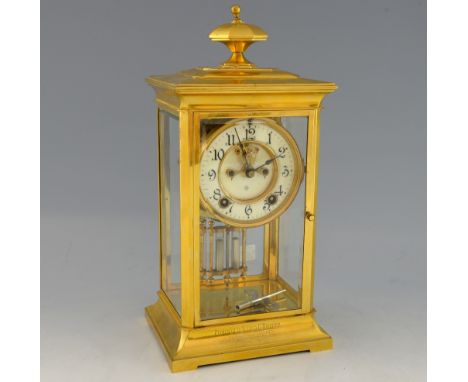 Ansonia Clock Company brass and glass mantel clock with twin train movement, open escapement, striking on a gong, with mercur