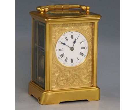 French brass and four glass carriage clock with lever movement, gilt engraved face plate with with scrolling decoration, whit