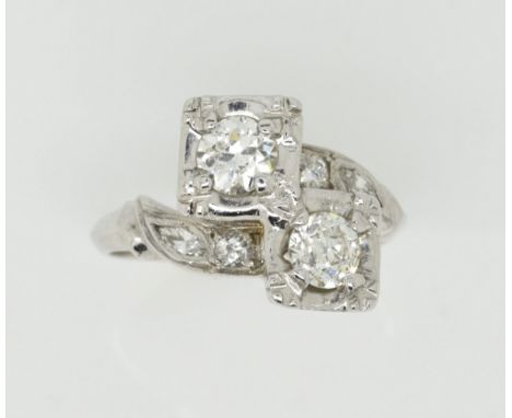 Vintage diamond twist ring, two central old cut diamonds, with marquise cut and round cut diamond set shoulders, estimated to