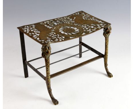 19th Century brass footman, the top panel pierced with coat of arms depicting lion and unicorn, 22.5cm x 31cm.    
