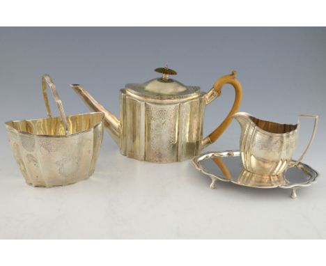 George III silver matched four piece tea service, comprising tea pot and stand, cream jug and sugar bowl, of serpentine form 