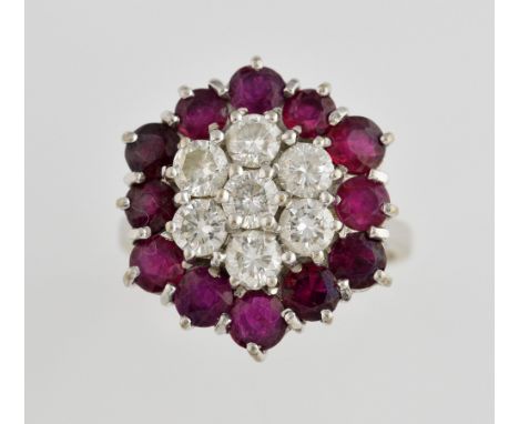 Vintage ruby and diamond cluster ring, set with seven round brilliant cut diamonds, estimated total diamond weight 1.05 carat