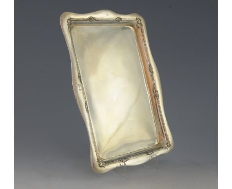 George V silver tray with serpentine border and moulded decoration, by W H Haseler Ltd., Birmingham, 1915, 12.9oz, 402g,.    