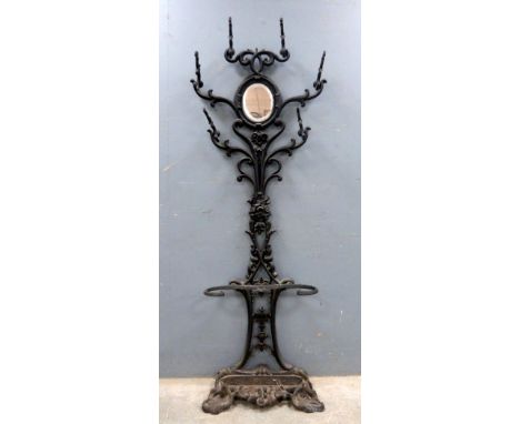 19th century cast-iron hallstand. 180cm high .    Over painted and with oxidization, finial and one scroll detached but prese