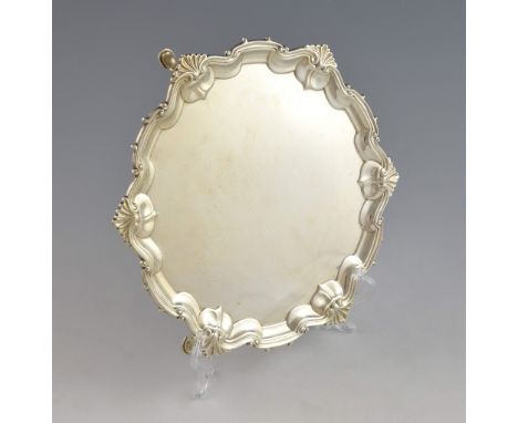 George V silver salver with shell and scroll moulded border, on three pad feet, by William Hutton & Sons Ltd., Sheffield, 192