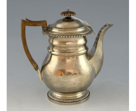George IV silver teapot, with silver filter cover within, fluted spread foot, plain bulbous body, gadroon rim and applied aca