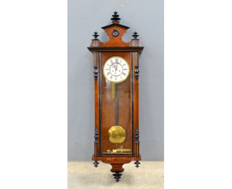 Late 19th century mahogany and ebonized Vienna regulator with white enamel face, black Roman numerals, 132cm height..    