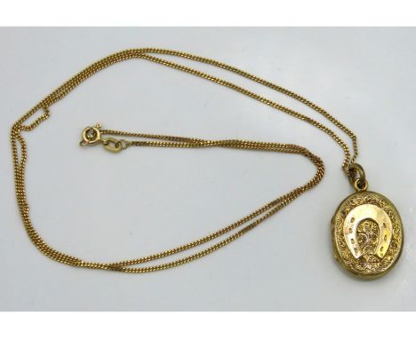 A 9ct gold chain, 580mm long with gold plated locket, chain weight 2.6g