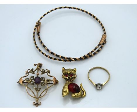A vintage ethnic bangle with rose gold (tested) mounting, an Edwardian brooch/pendant set with amethyst & pearl, a/f twinned 