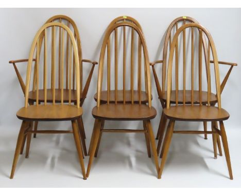 A set of six Ercol elm dining chairs including two carvers