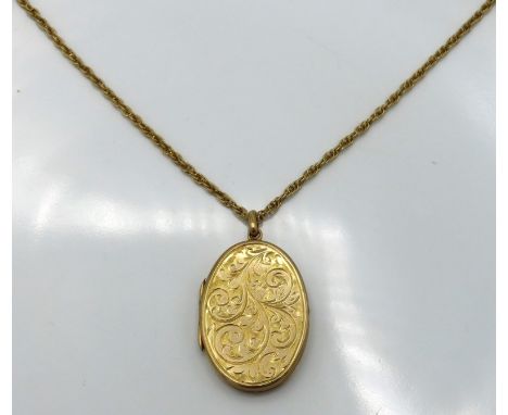A 9ct gold locket & chain, locket 46mm drop, chain approx. 560mm long, 16.5g