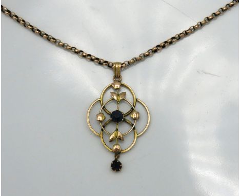 An early 20thC. chain & pendant, set with blue stones, chain 440mm long, pendant 46mm drop, tests electronically as 9ct gold,