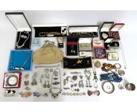 A quantity of mixed costume jewellery including a silver ingot & chain & some other small silver pieces