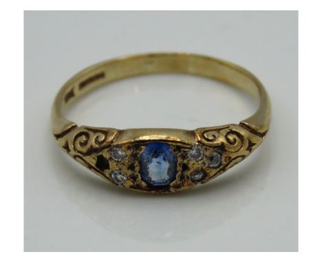 An antique 9ct gold ring with carved decor set with sapphire & diamond, lacking one diamond, 2.4g, size R