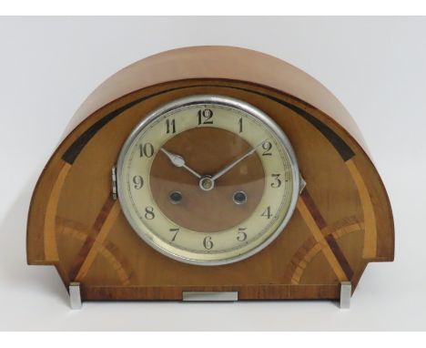 An art deco mantle clock with inlaid decor, fault with door hinge, 340mm wide 